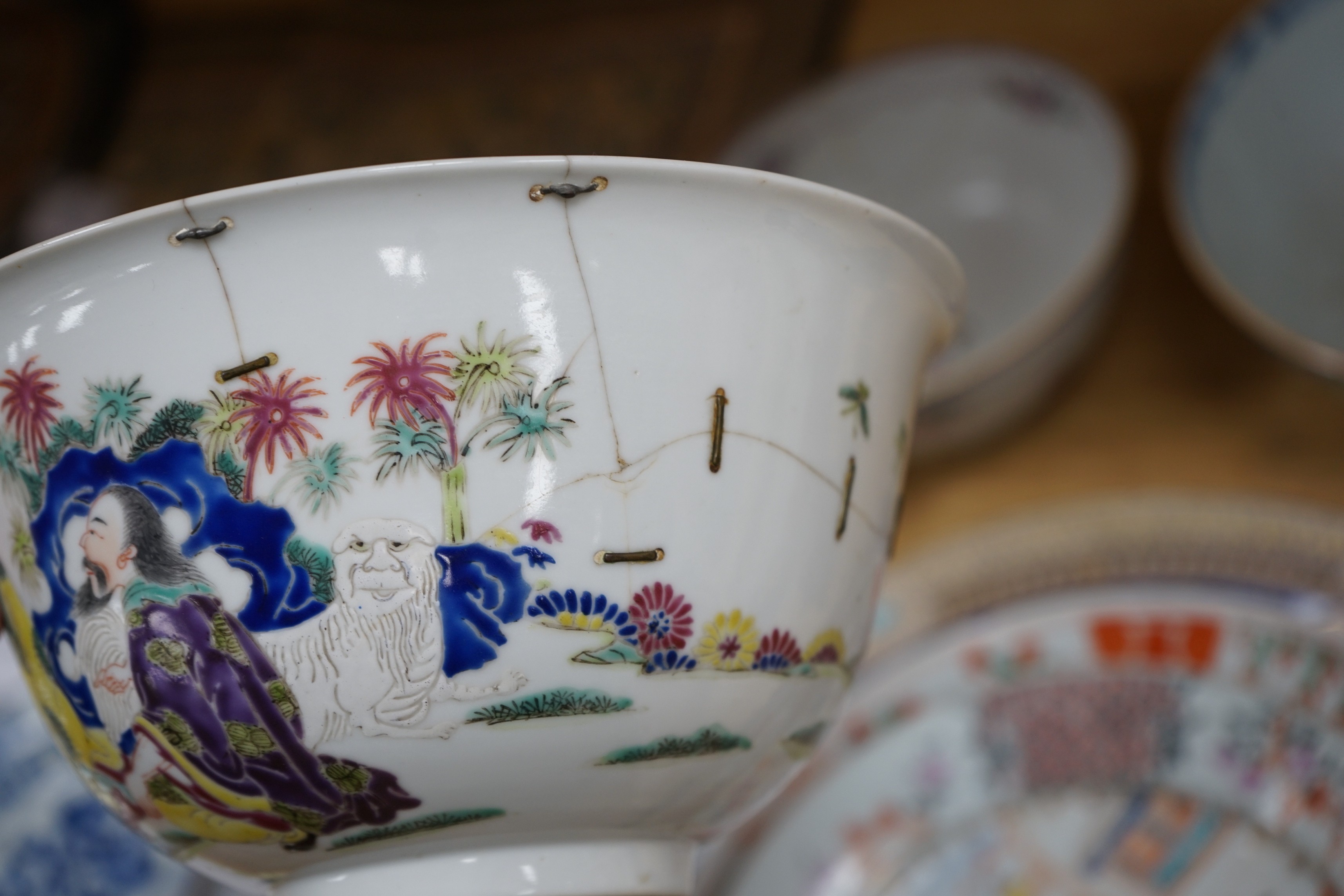 A group of 18th century and later Chinese enamelled and blue and white porcelain dishes and three bowls, Largest dish 35.5 cm diameter